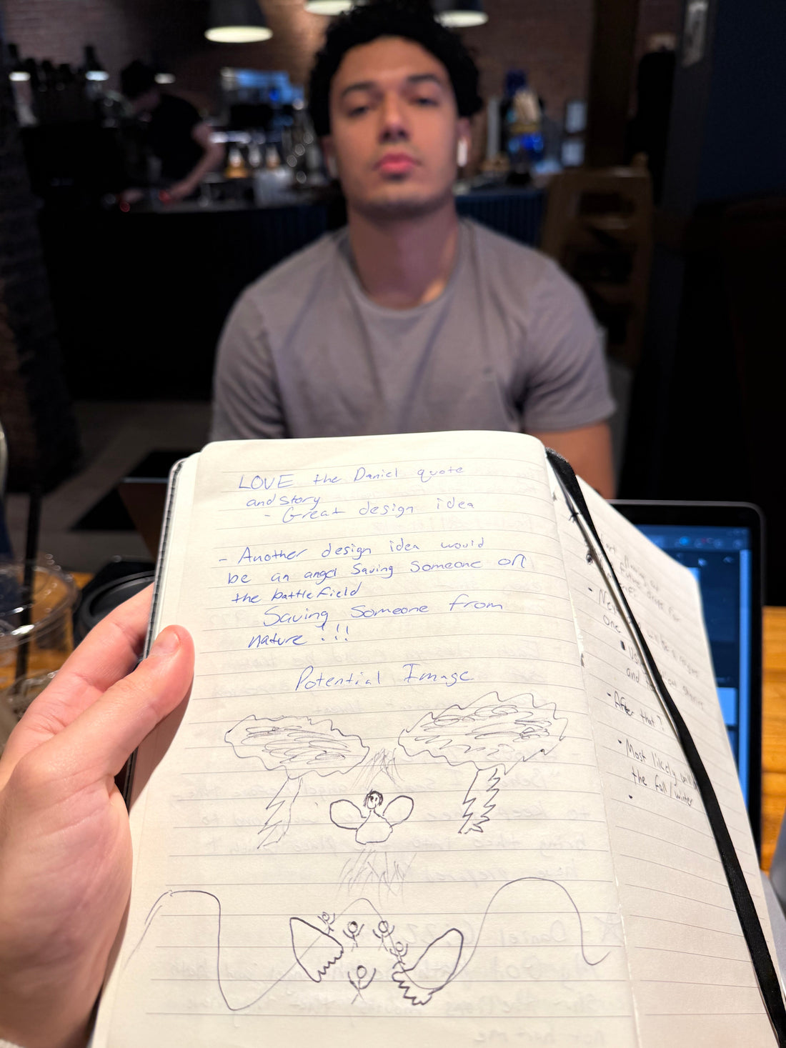 Andrew sketching an early Amaserafi design on a drawing tablet at a desk.